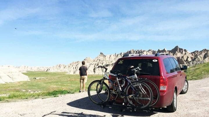 minivan camper conversion with two bikes on back