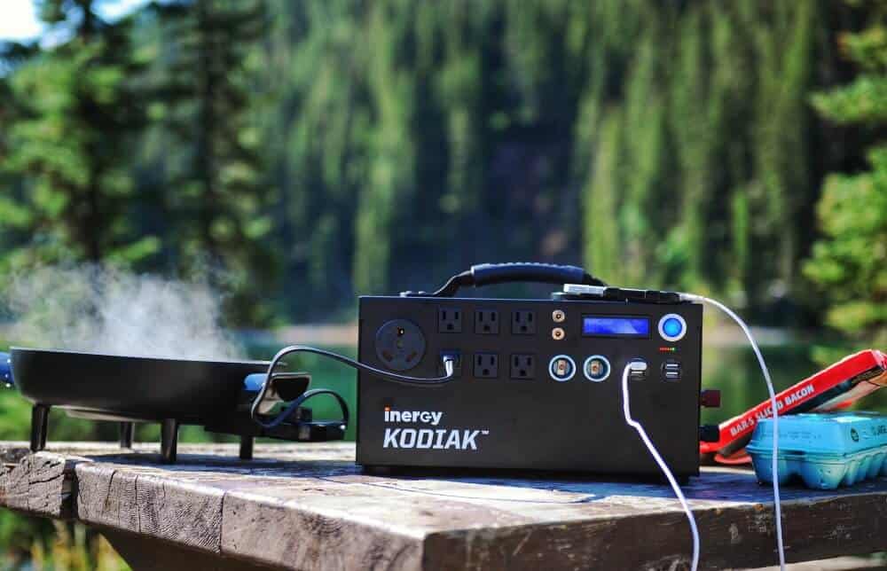The Inergy Kodiak solar generator shown on a picnic table while camping