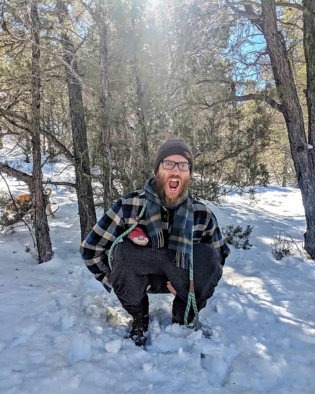 John goes to the bathroom in the woods instead of in his campervan