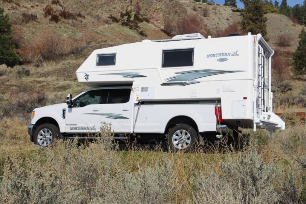 truck camper parked near the mountain area