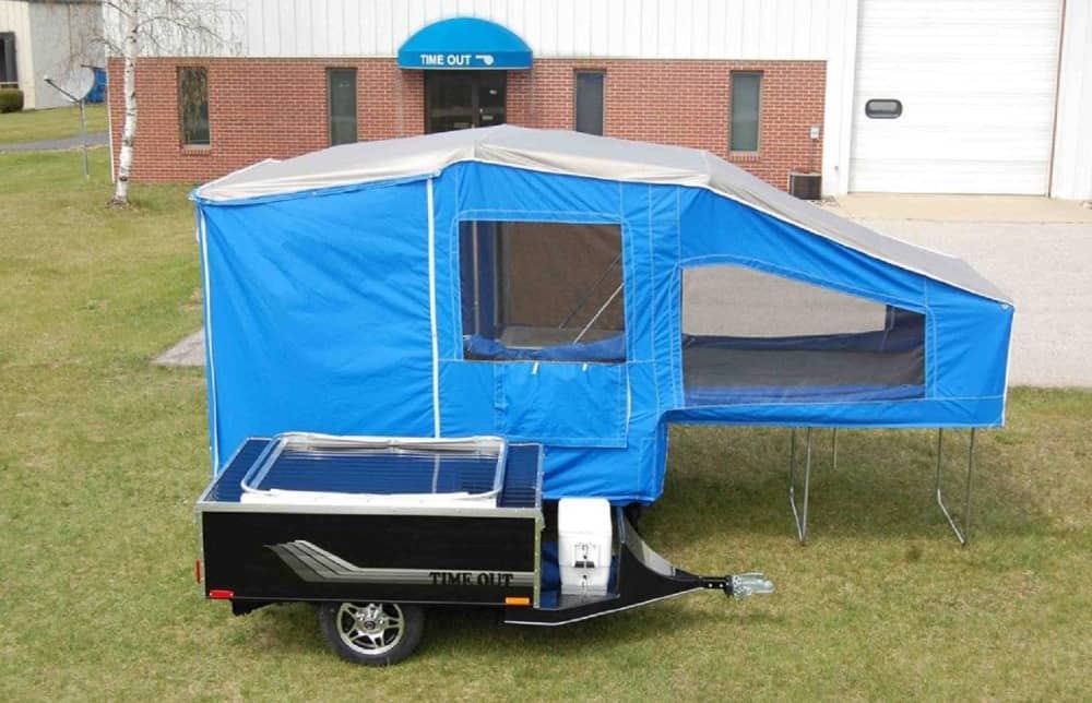 Bright Blue Time Deluxe motorcycle camper parked on grass