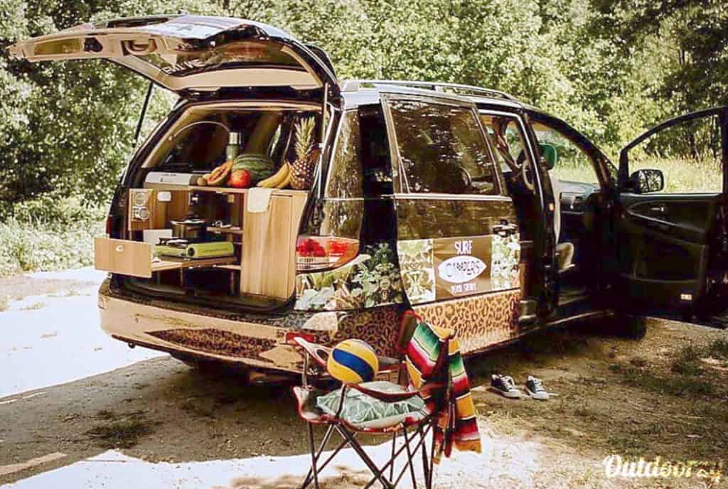 Budget campervan rental in Europe parked with trunk popped
