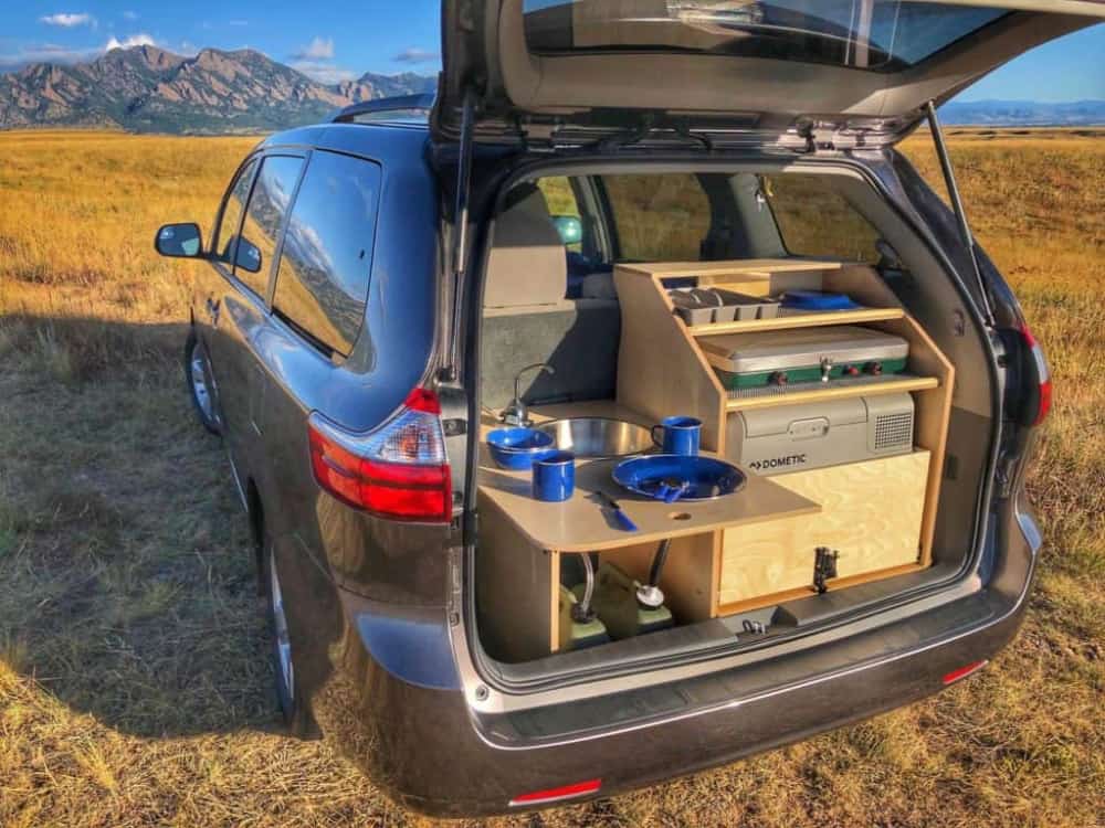 View into the trunk of a minivan camper converted with Contravan's conversion.