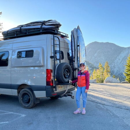 woman standing next to sprinter van conversion