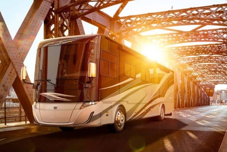 Tiffin Allegra Class A motorhome with bunks driving over bridge