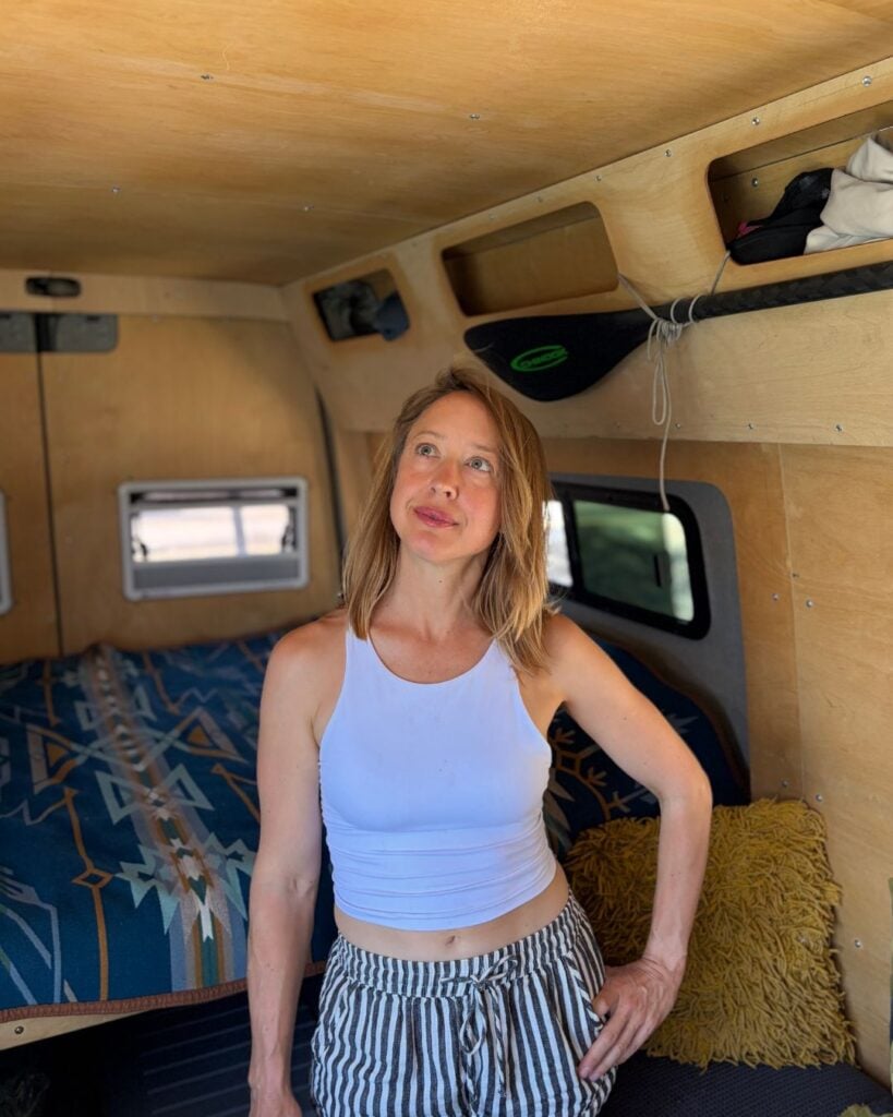 woman standing in a sprinter van