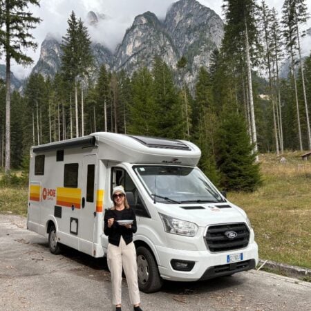 woman standing in front of an indie camper