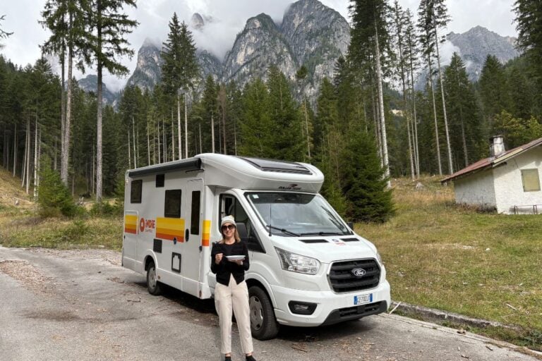 woman standing in front of an indie camper
