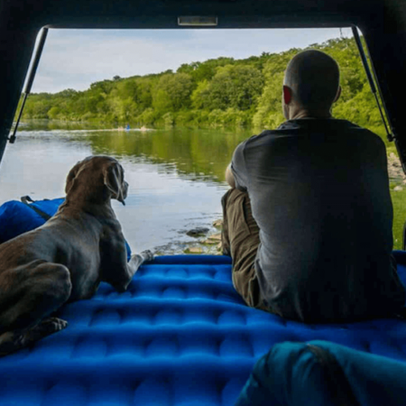 truck bed mattress with man and dog