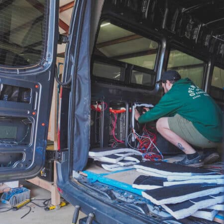 thinsulate van insulation kits being installed in a sprinter van
