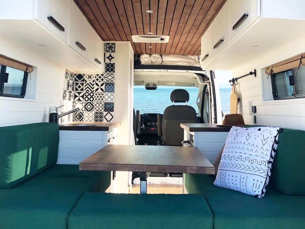 promaster campervan parked at the beach showing its interior