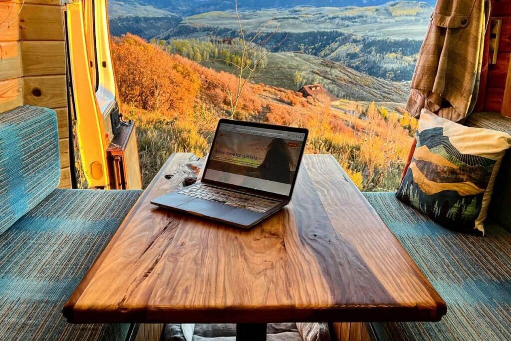a solopreneur's laptop in a van