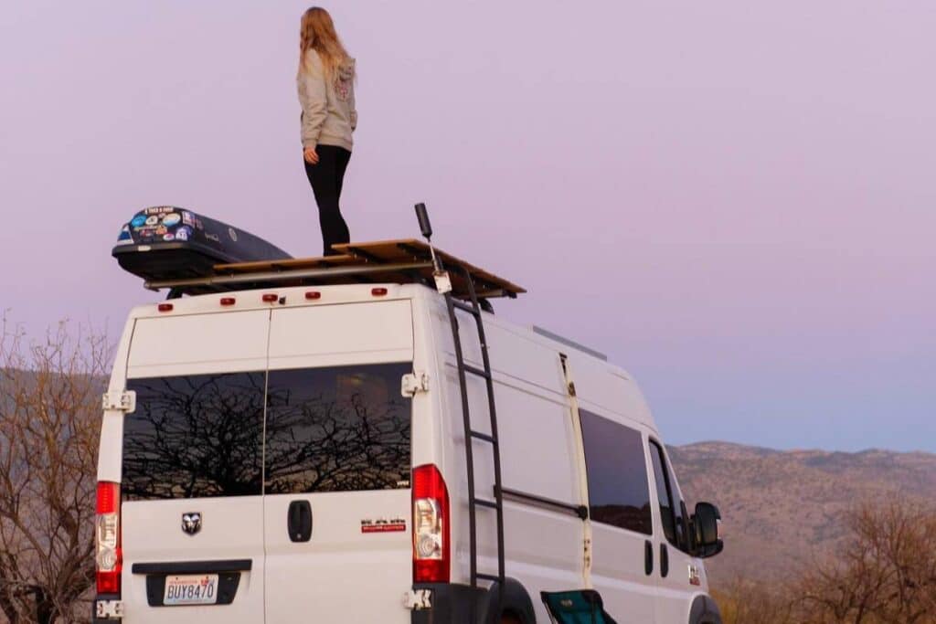 woman on a campervan rooftop