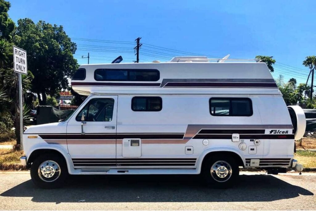 white ford falcon van parked outdoors