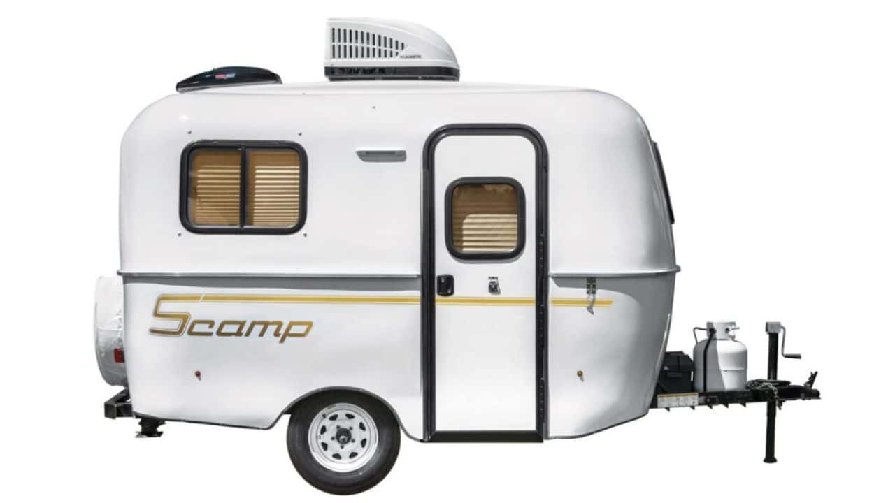 A Scamp 13 Deluxe fiberglass trailer with the front bathroom