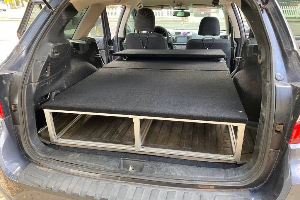 minivan camper showing its bed set up
