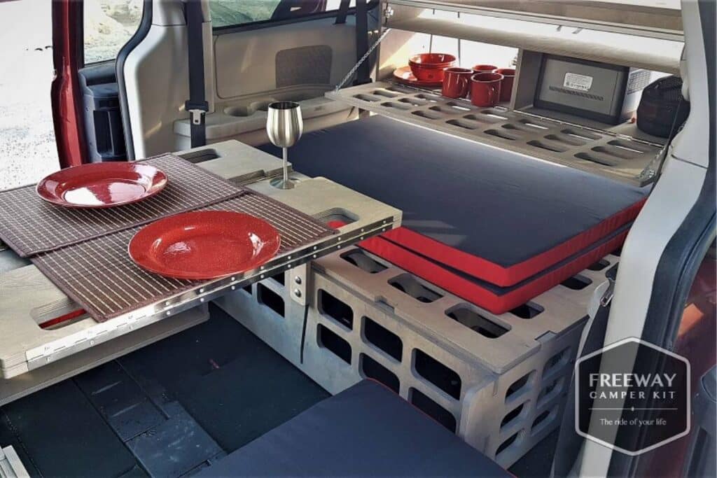 minivan camper showing its dining area by freeway campers