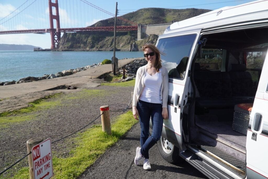 woman standing by chevy astro