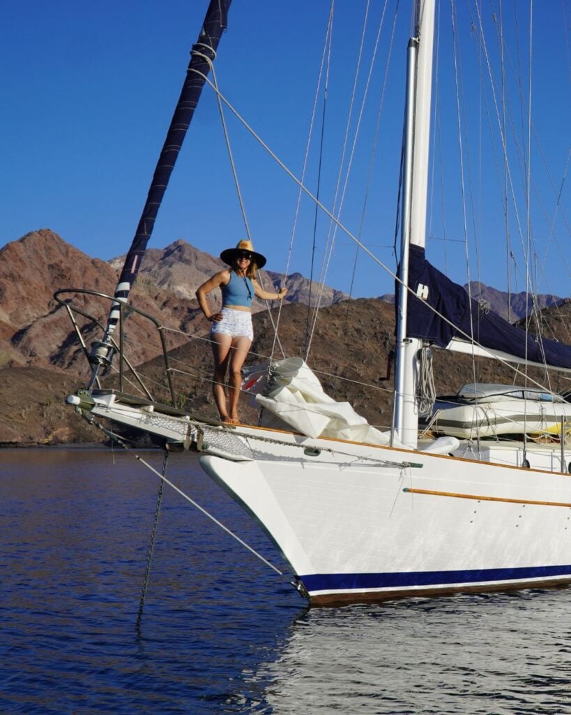 woman on the bow of a sailboat