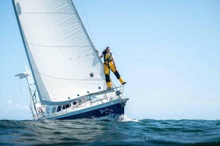 woman on the bow of her sailboat