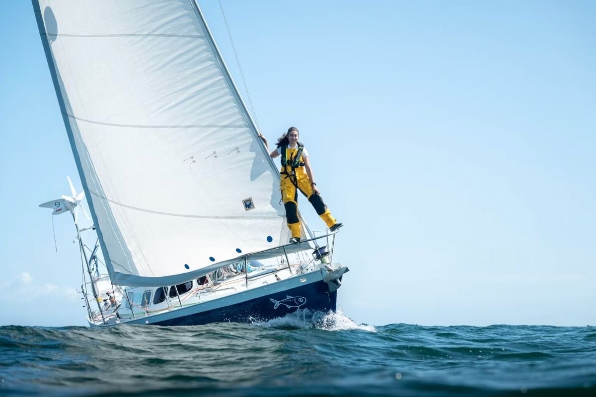 woman on the bow of her sailboat
