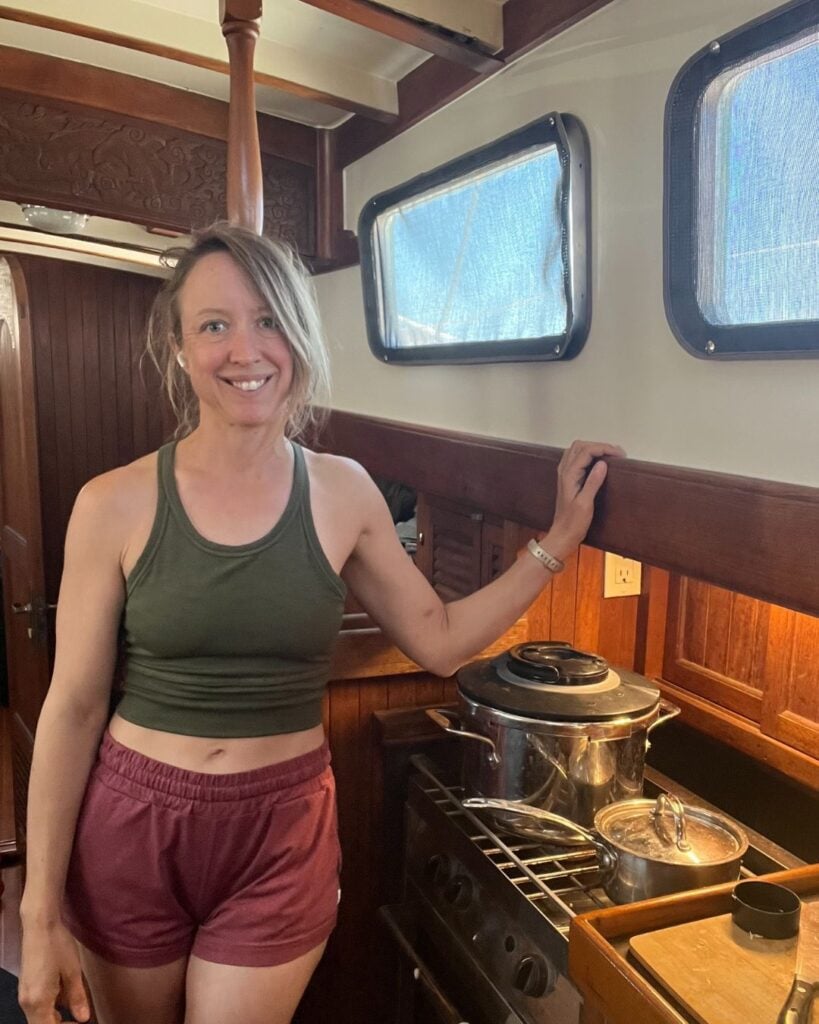 woman in sailboat galley