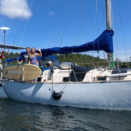 couple on the deck of their sailboat