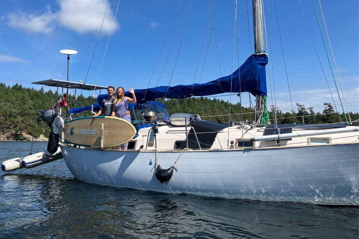 couple on the deck of their sailboat