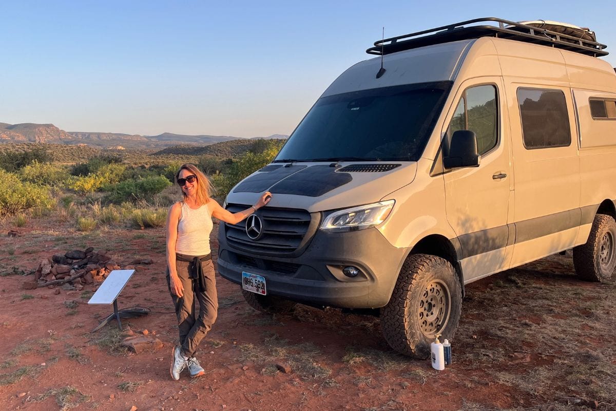 woman by campervan in Sedona