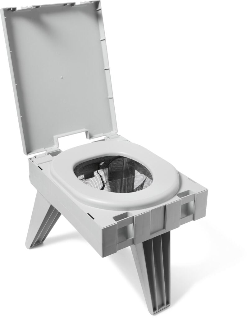 A folding portable toilet with a seat and a bag liner, the fold-out dry toilet option for a van