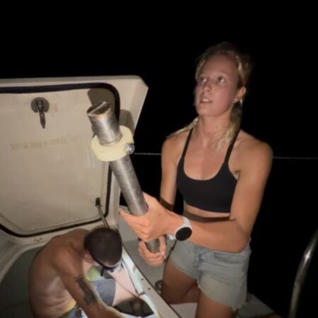 woman holding a broken rudder