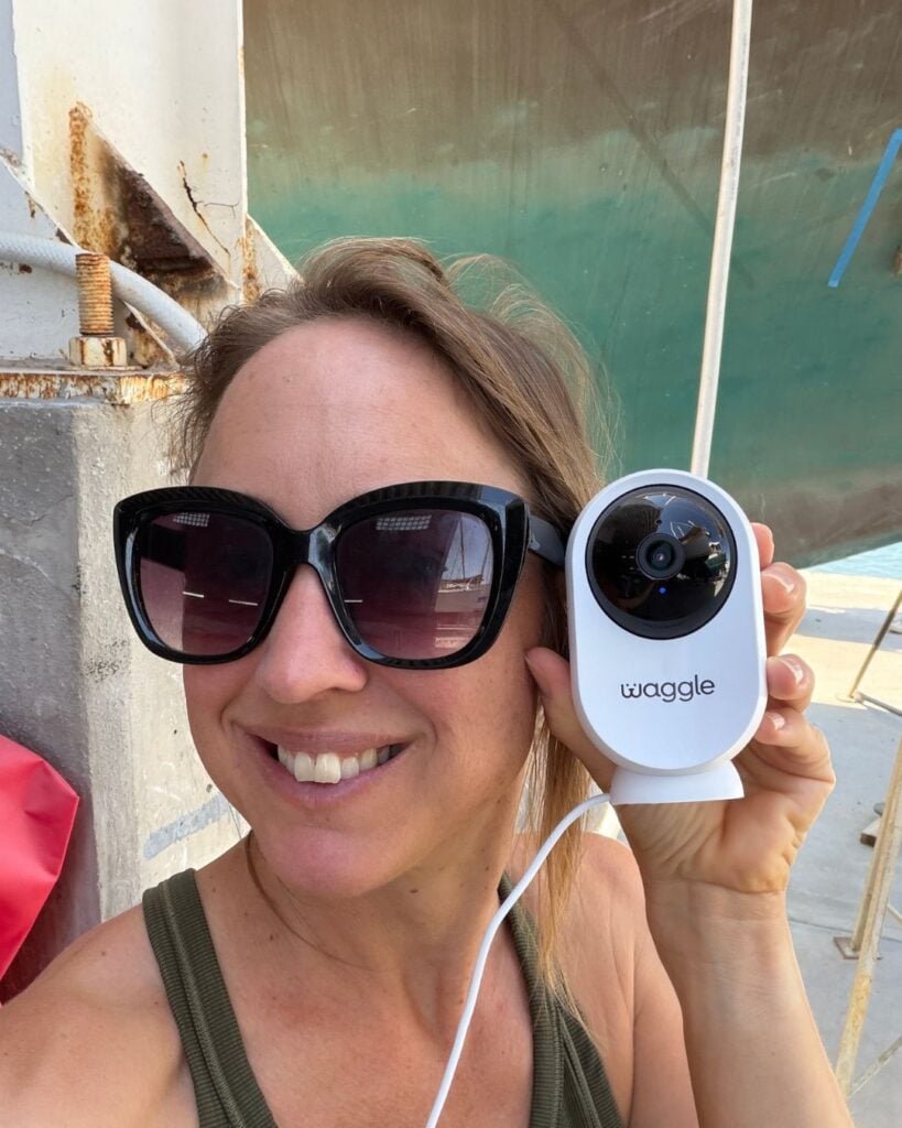woman holding a wifi pet camera