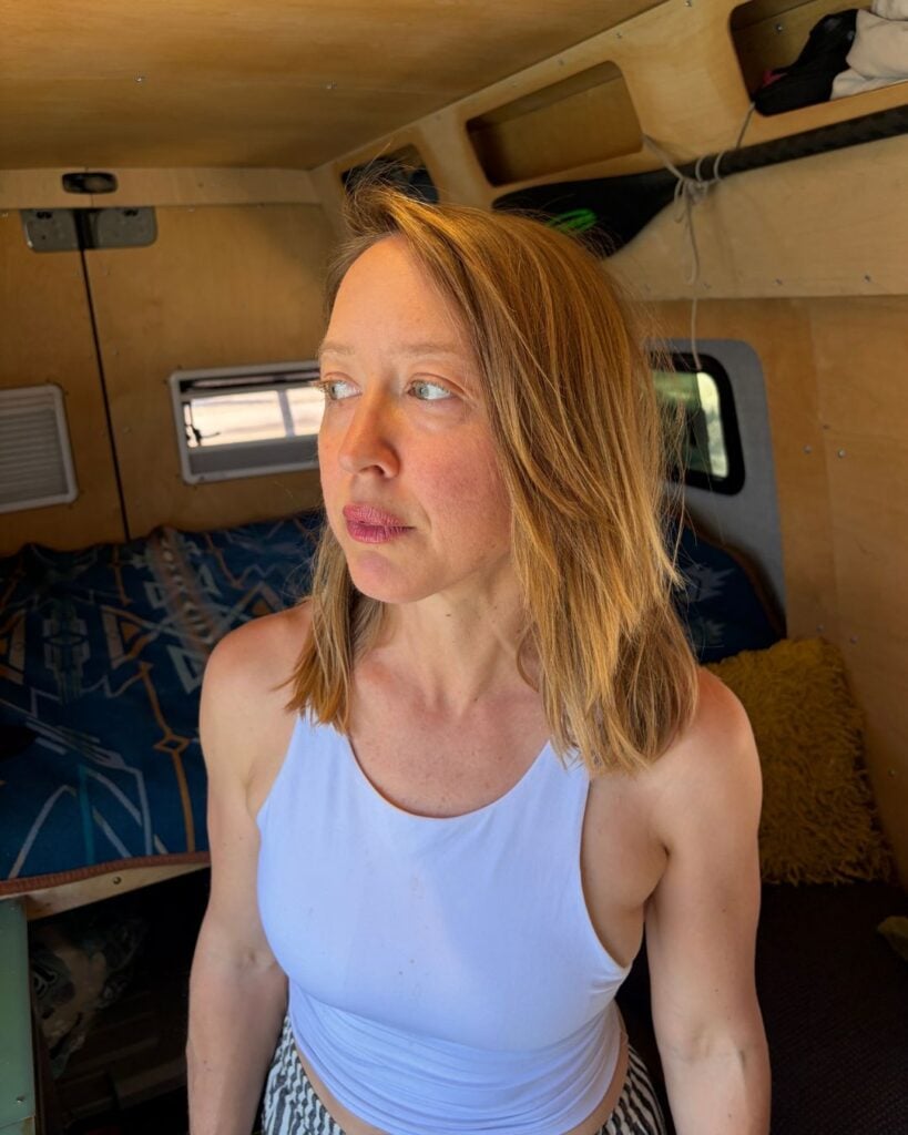 woman giving side eye outside sprinter van window
