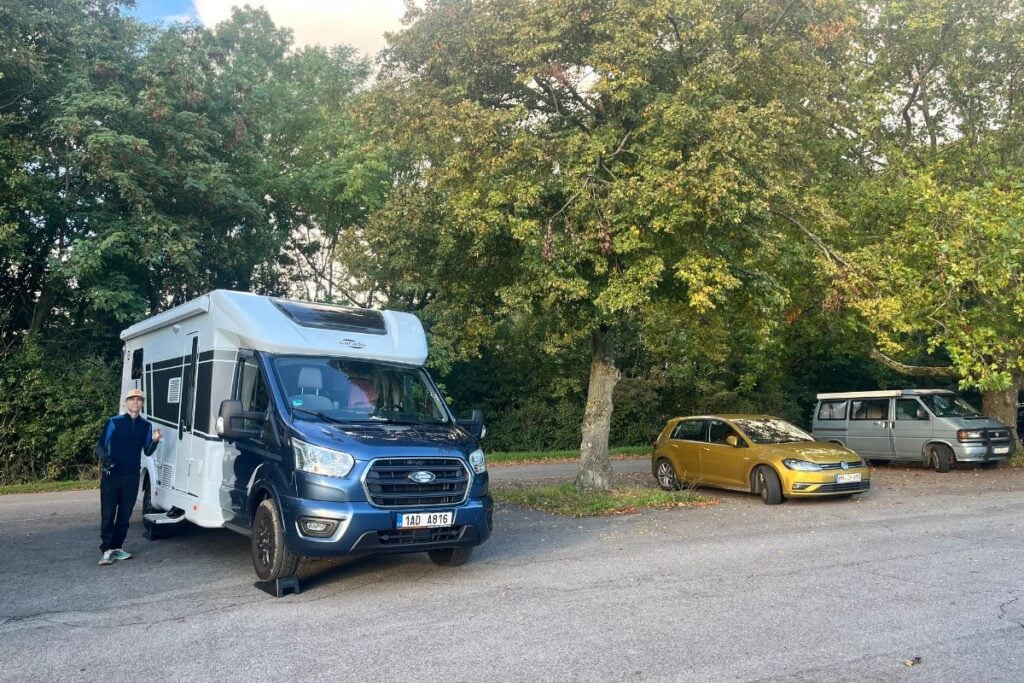 man standing near camper in Germany