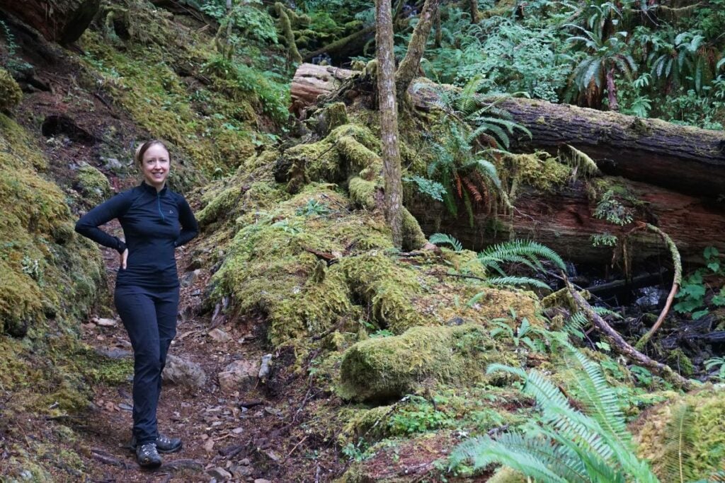 woman hiking in the mossy woods