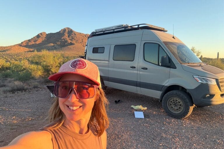 Kristin in front of campervan in the desert