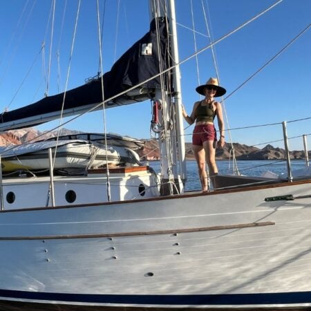 woman standing on a sailboat