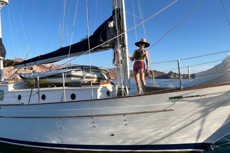 woman standing on a sailboat