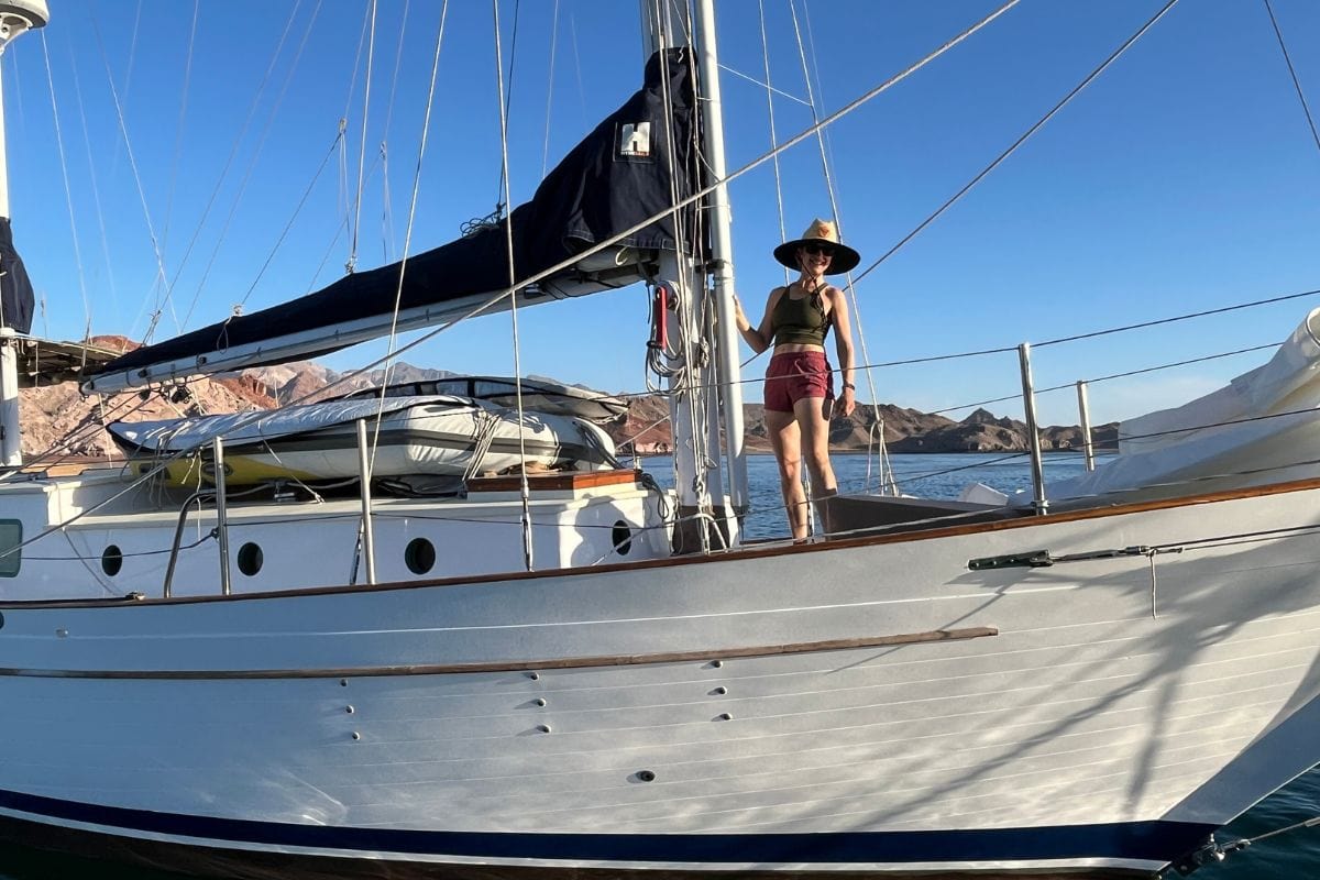 woman standing on a sailboat