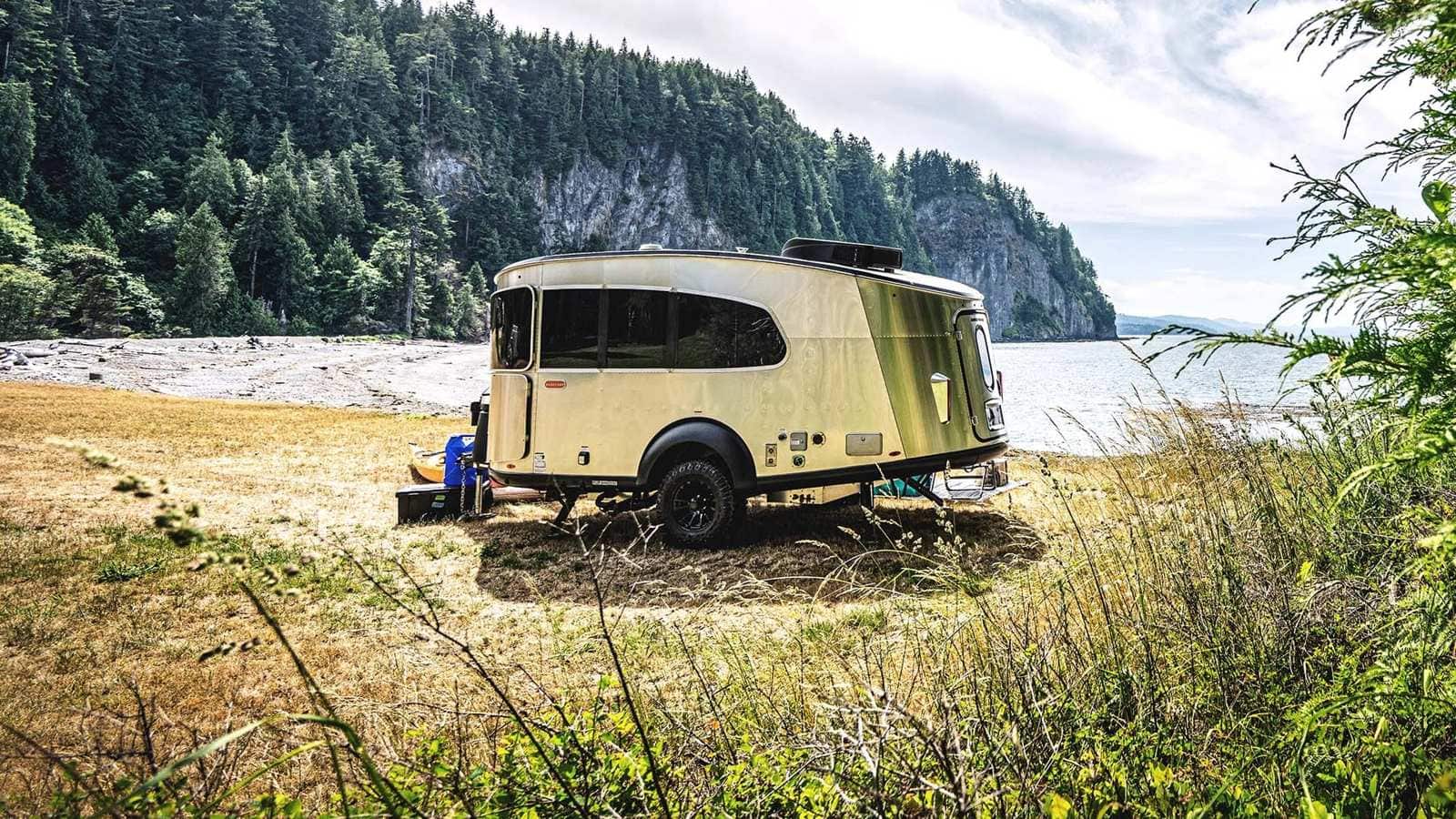 Airstream Basecamp parked at a lakeside