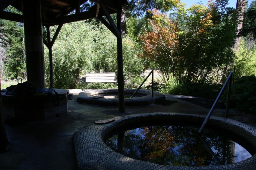 Tiled spiral hot tubs under a timber shelter, Breitenbush Hot Springs
