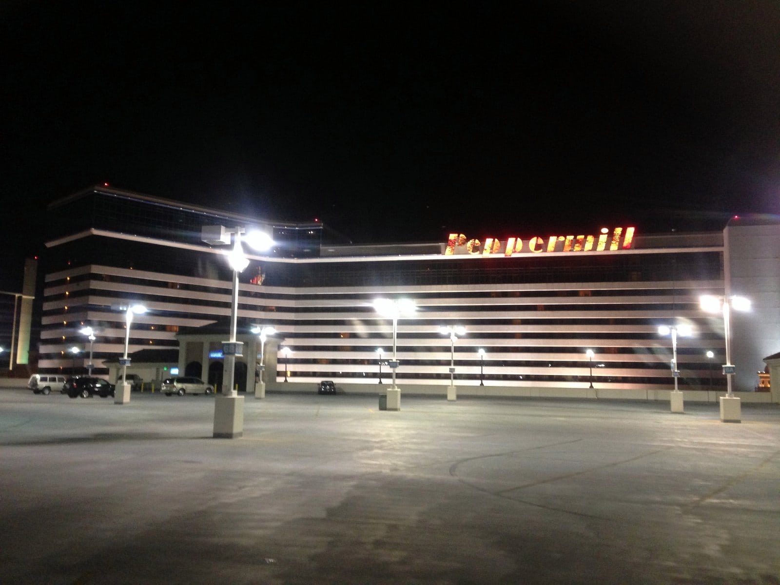 A casino parking lot at night, lit by tall lights, Peppermill Reno