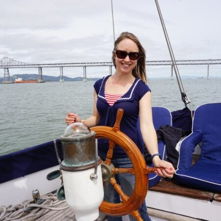 Kristin at the wheel of her CT-41 sailboat on San Francisco Bay