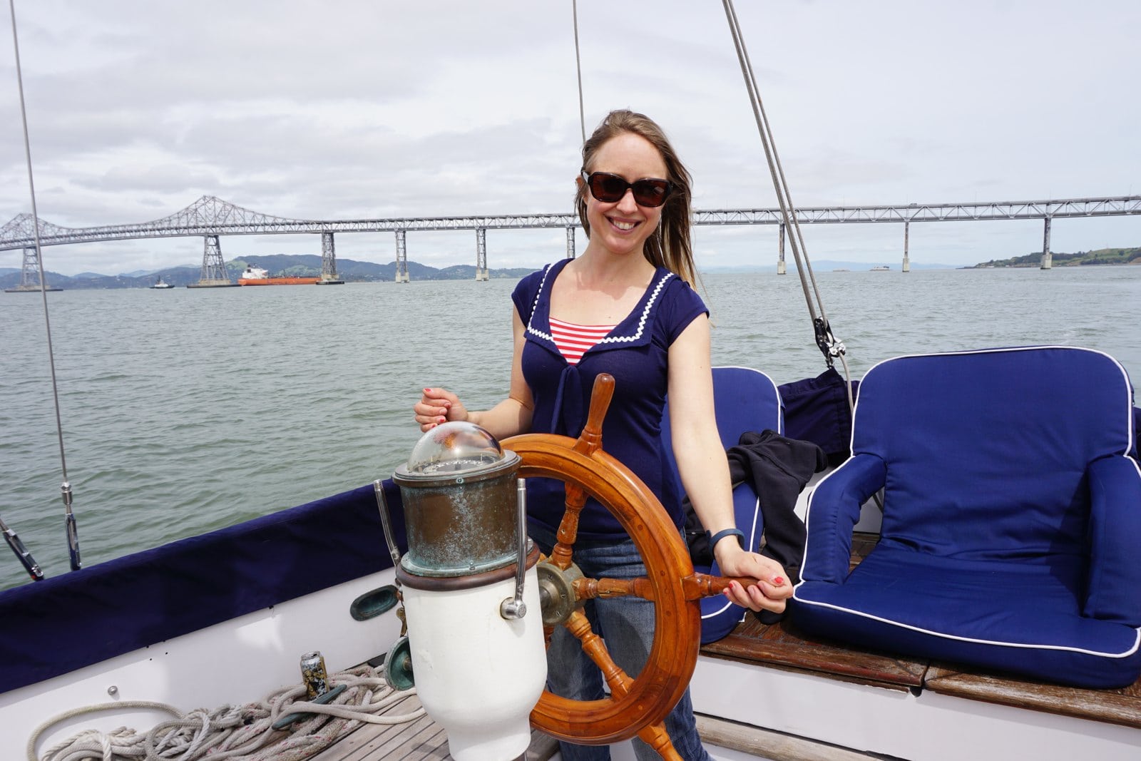 Kristin at the wheel of her CT-41 sailboat on San Francisco Bay