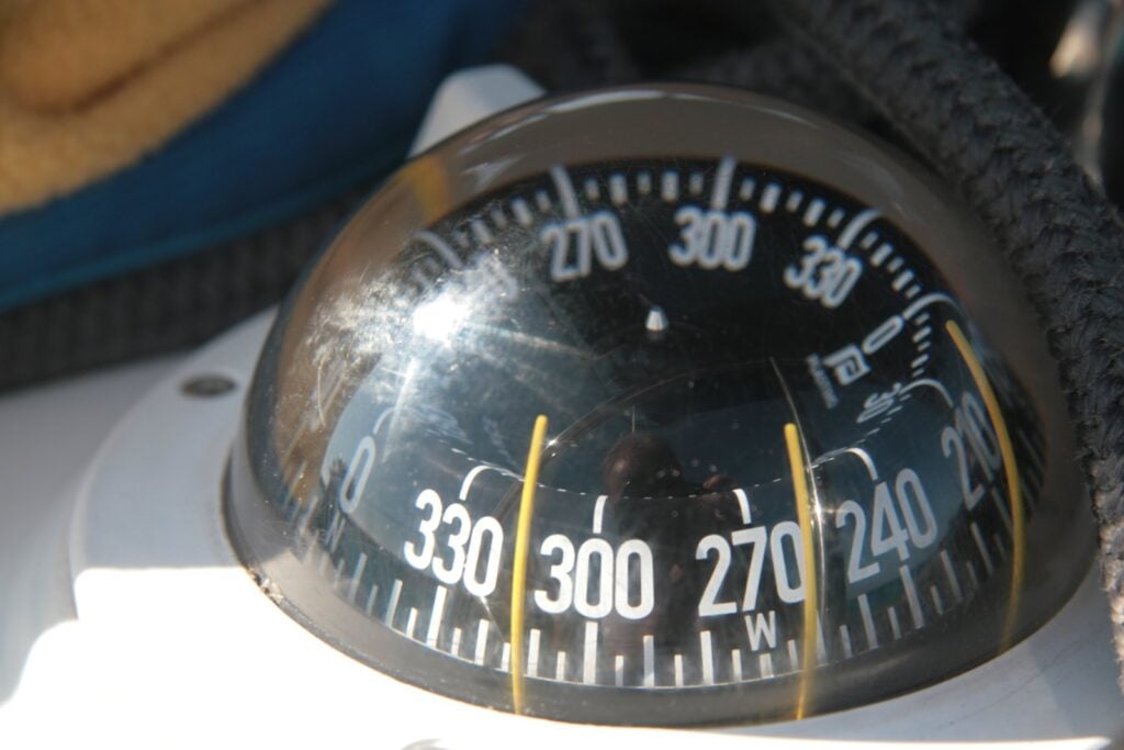 Close-up of a liquid steering compass on a sailboat