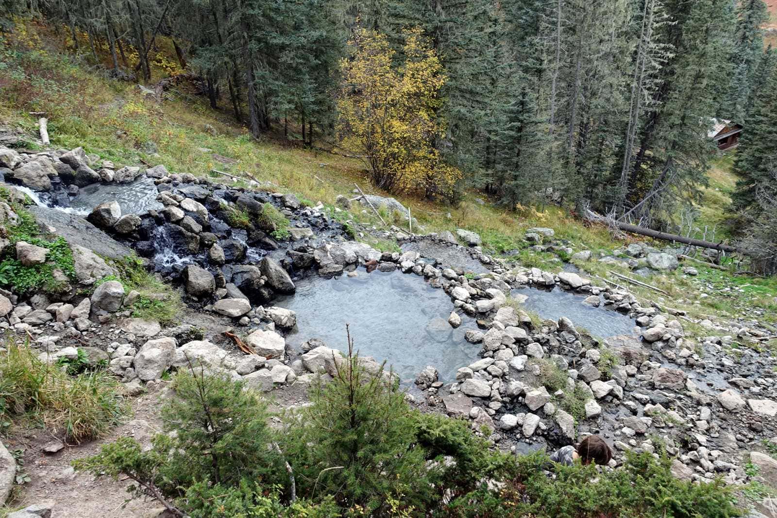 Rock-lined pools on a forested hillside in autumn, San Antonio Hot Springs